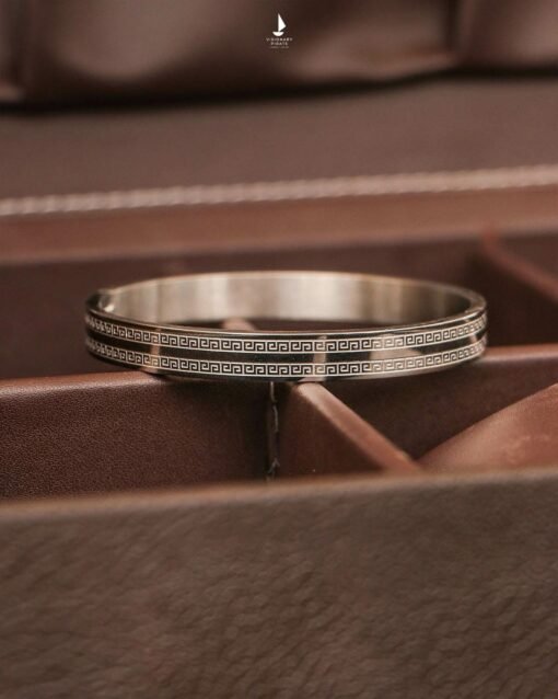 Men's stainless steel kada/bracelet with Greek key pattern design.