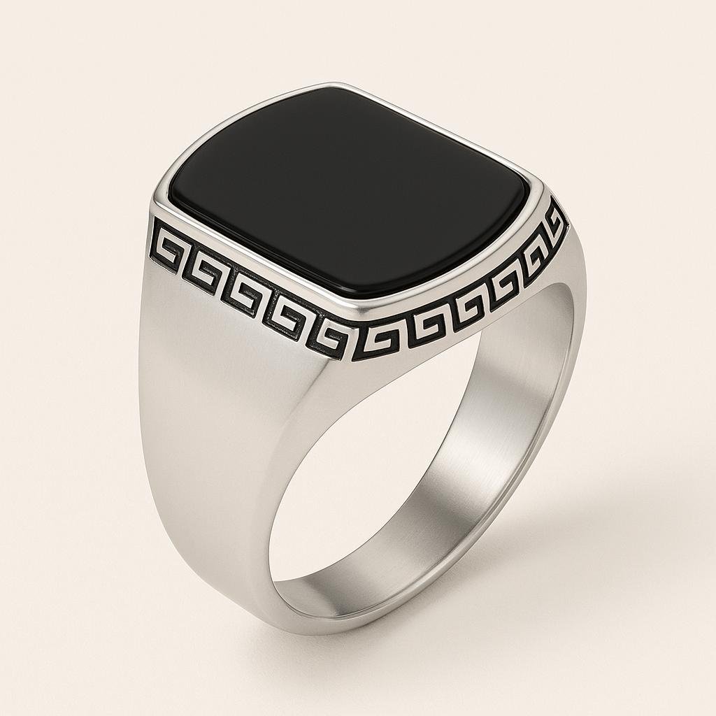 a close-up shot of italian styled ring with beautiful design embeded on it and a black stone on the top.